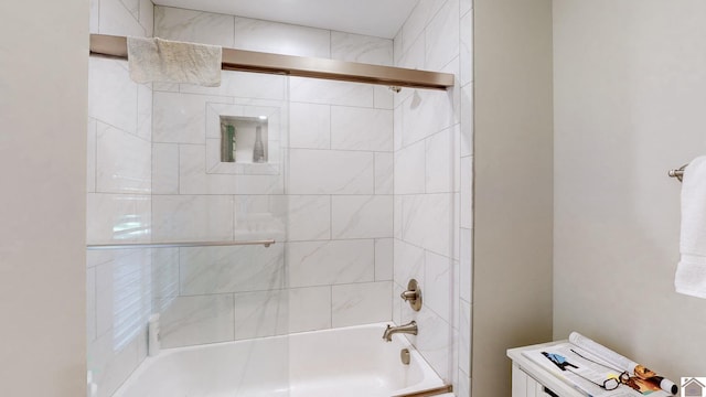 bathroom featuring shower / bath combination with glass door