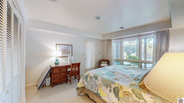 bedroom with light colored carpet