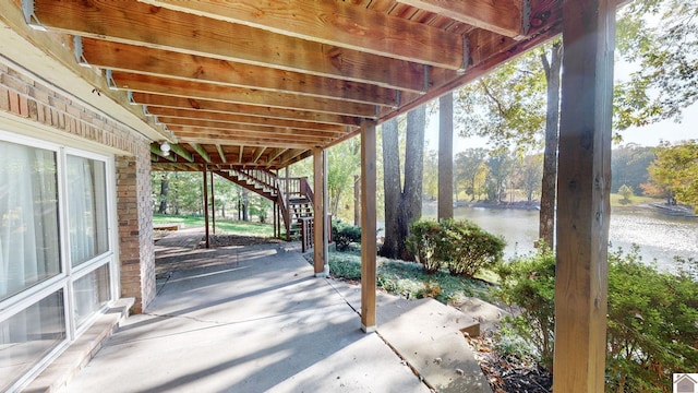 view of patio / terrace with a water view