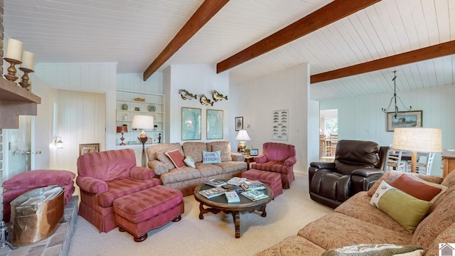 carpeted living room with vaulted ceiling with beams