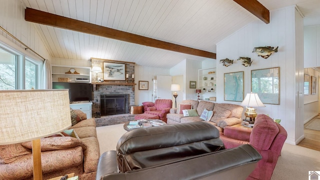 living room featuring wood walls, vaulted ceiling with beams, a fireplace, and built in shelves