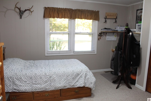 carpeted bedroom featuring ornamental molding