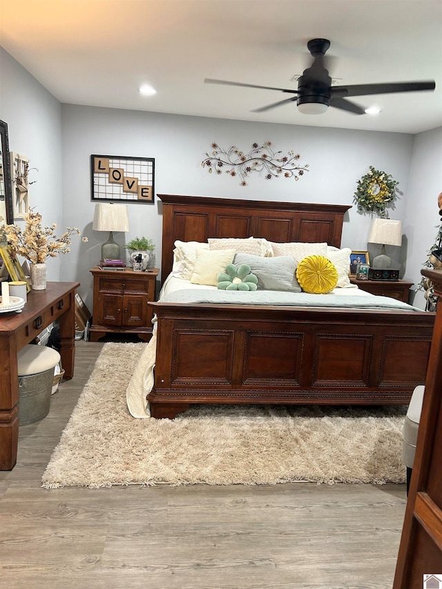 bedroom featuring light hardwood / wood-style floors and ceiling fan