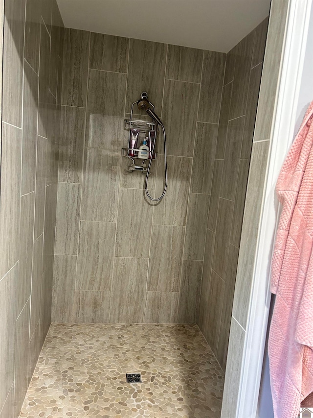 bathroom with tiled shower