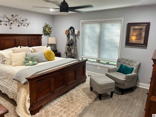 bedroom featuring light hardwood / wood-style flooring and ceiling fan