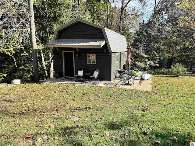 view of outbuilding featuring a lawn