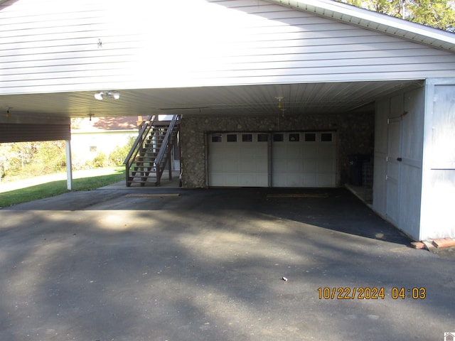 garage with a carport