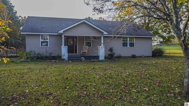 ranch-style house with a front lawn and covered porch