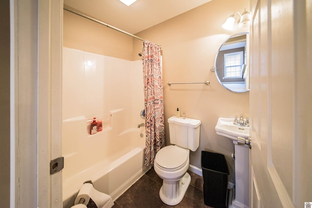 bathroom featuring toilet, tile patterned flooring, and shower / tub combo