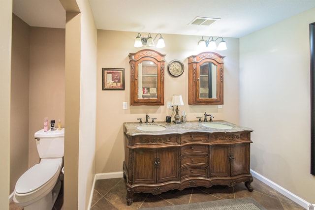 bathroom with toilet and vanity