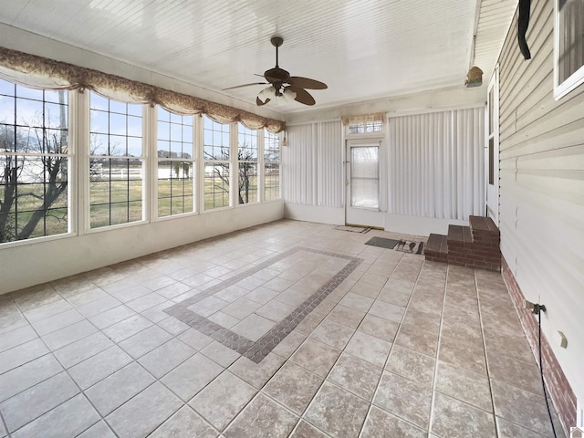 unfurnished sunroom with plenty of natural light
