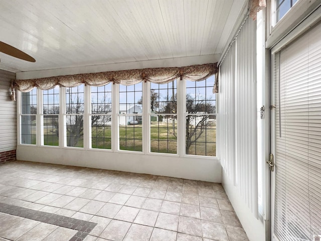 unfurnished sunroom with tile patterned flooring