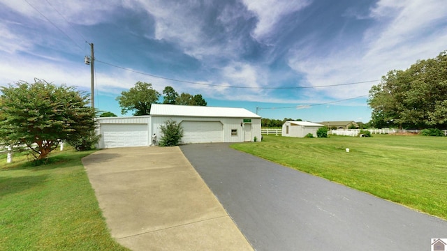 ranch-style house featuring a front yard and a garage