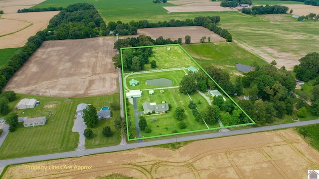 birds eye view of property featuring a rural view