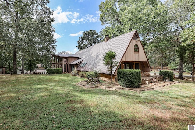 view of property exterior with a lawn