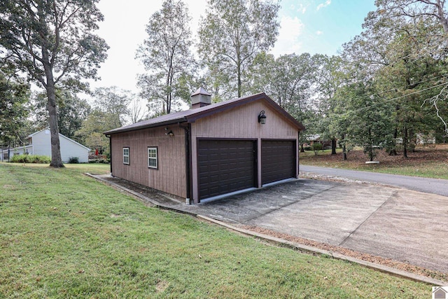 garage with a yard