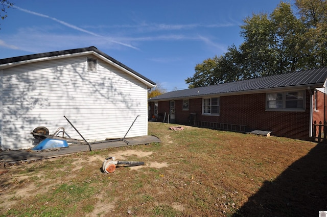 view of home's exterior with a yard