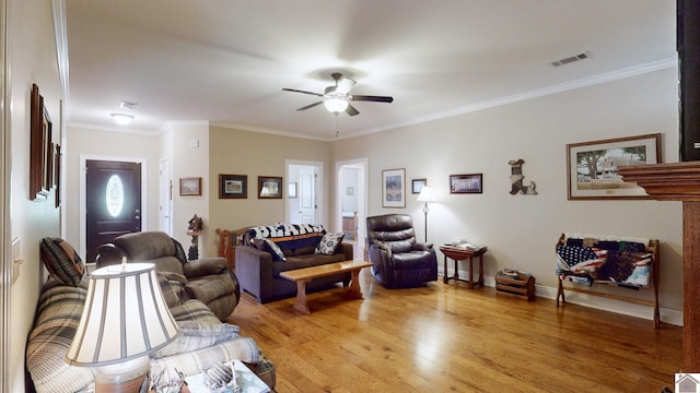 living room with light hardwood / wood-style floors, crown molding, and ceiling fan