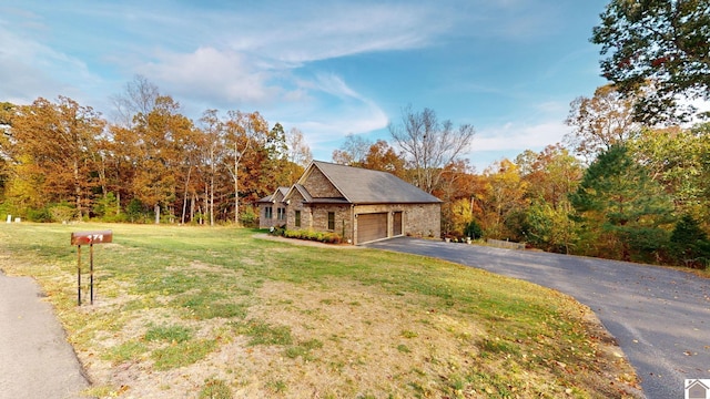 view of front facade featuring a front yard and a garage