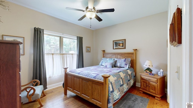 bedroom featuring wood-type flooring and ceiling fan