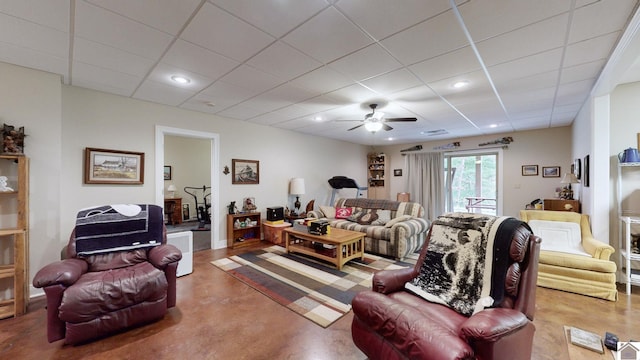 living room with concrete floors and ceiling fan