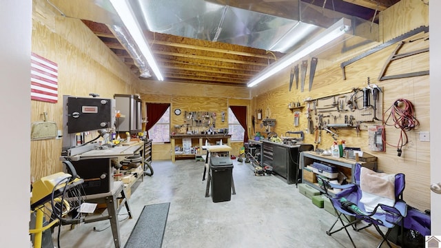 misc room featuring concrete floors and a workshop area