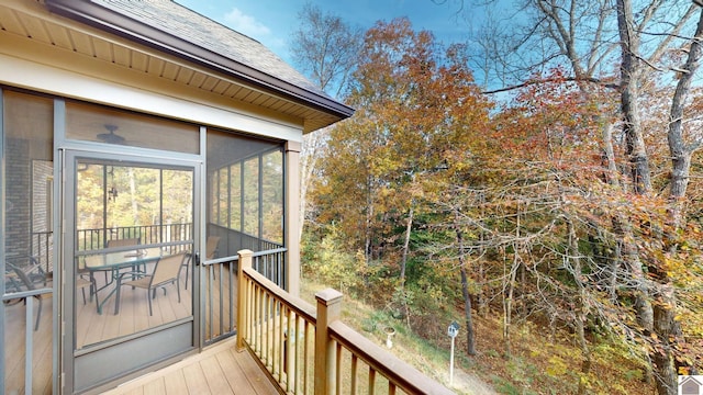 wooden terrace featuring a sunroom