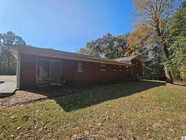 view of property exterior featuring a lawn