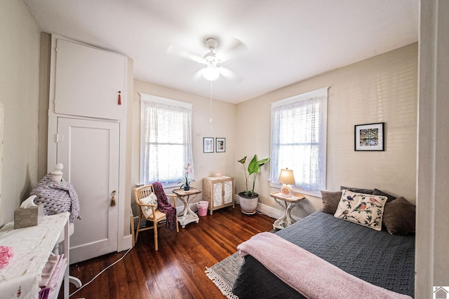 bedroom featuring dark hardwood / wood-style floors and ceiling fan