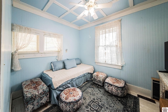 bedroom with ceiling fan and multiple windows