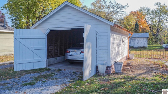 1804 Market St, Metropolis, IL 62960 - detached garage featuring fence and driveway