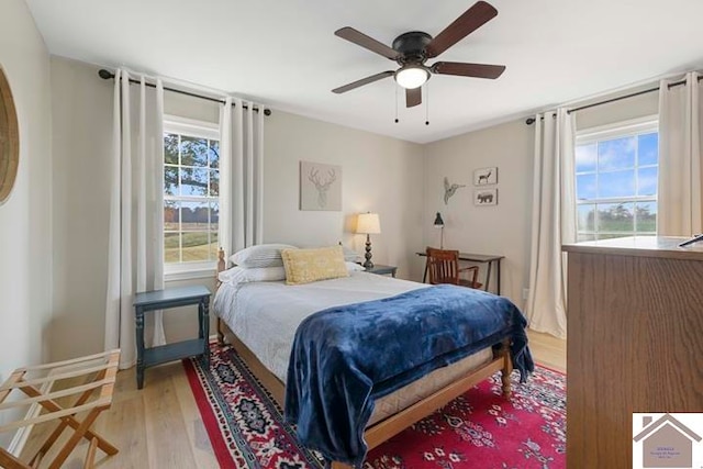 bedroom featuring light hardwood / wood-style flooring and ceiling fan