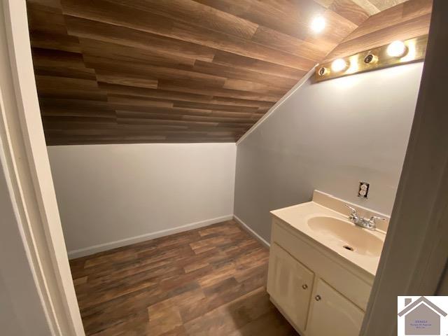 bathroom with vanity, lofted ceiling, wood-type flooring, and wood ceiling