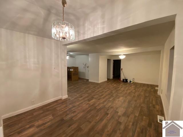 interior space with ceiling fan and dark hardwood / wood-style flooring