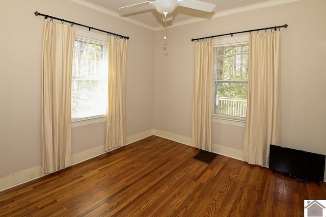 spare room featuring ornamental molding, ceiling fan, and dark hardwood / wood-style flooring