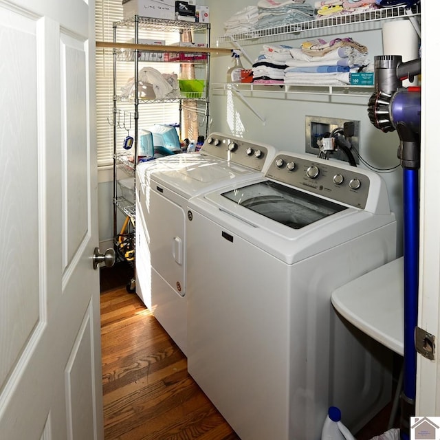 washroom featuring washer and dryer and wood-type flooring