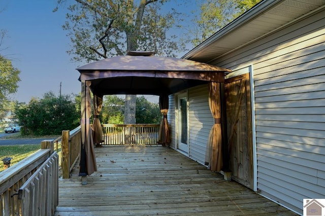 wooden deck featuring a gazebo