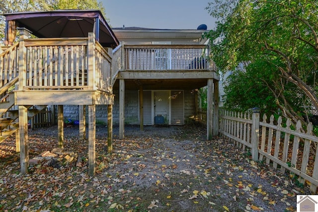 back of property featuring a deck