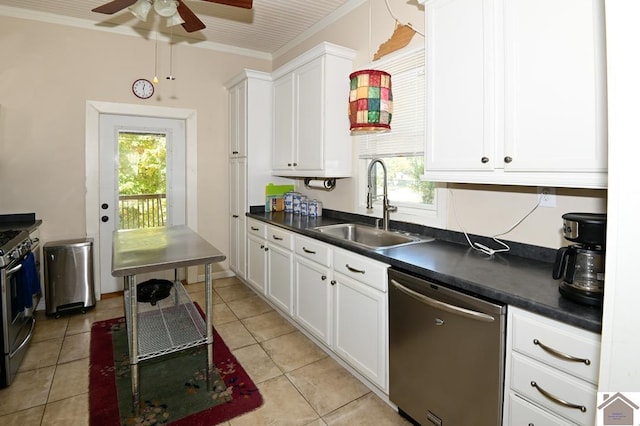 kitchen featuring white cabinetry, appliances with stainless steel finishes, ornamental molding, and sink