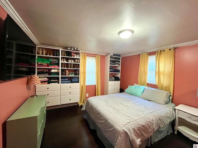 bedroom featuring ornamental molding and dark wood-type flooring