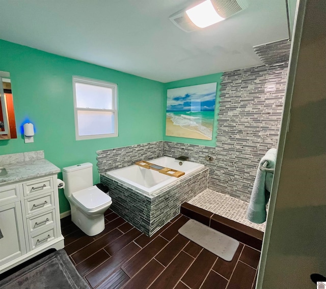 full bathroom featuring hardwood / wood-style flooring, vanity, toilet, and shower with separate bathtub