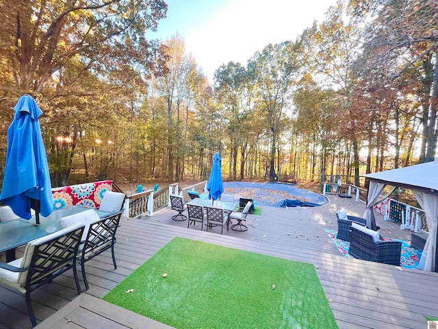 wooden deck with an outdoor living space