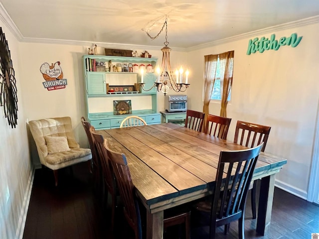 dining room featuring a chandelier, dark hardwood / wood-style flooring, and crown molding