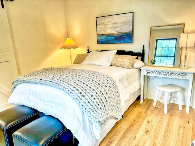 bedroom with light wood-type flooring