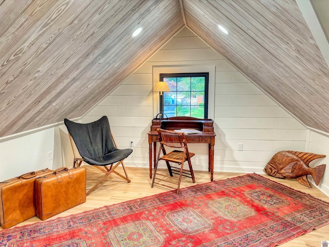 bedroom featuring light hardwood / wood-style flooring and vaulted ceiling