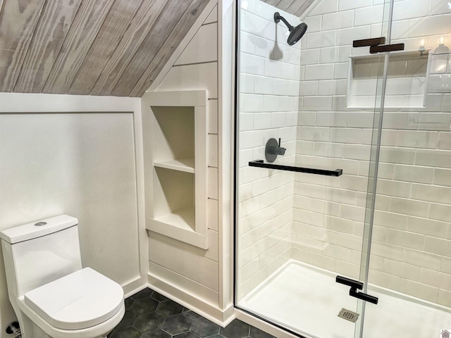 bathroom with vaulted ceiling, tile patterned flooring, an enclosed shower, and toilet