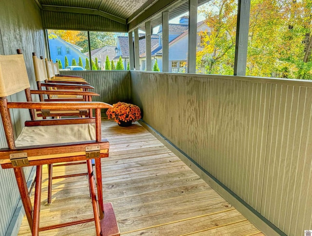 unfurnished sunroom with vaulted ceiling