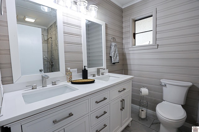 bathroom with toilet, crown molding, walk in shower, and vanity