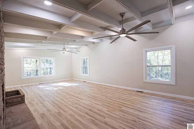 unfurnished living room featuring light hardwood / wood-style floors, vaulted ceiling with beams, and ceiling fan