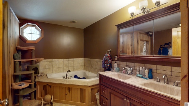 bathroom featuring vanity and a bathtub